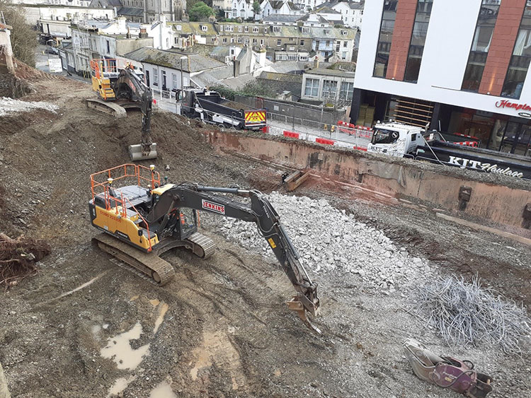 A digger excavating the foundations for the new Premier Inn hotel in Torquay.