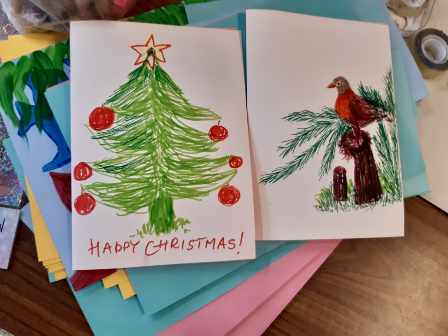 Children's crafted colouring Christmas cards one with a Christmas tree and one with a robin