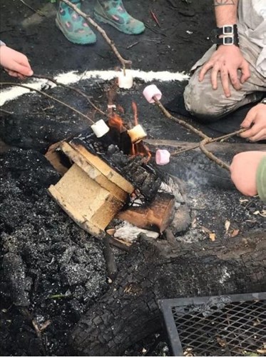 Children roasting marshmallows