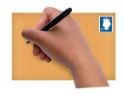 Hand with pen writing on the front of an envelope