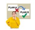 A woman in a yellow jumper thinking about plan a or plan b
