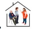 Three people stood in a an outline of a house with a woman pointing and talking