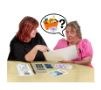 Two woman talking at a table looking at documents