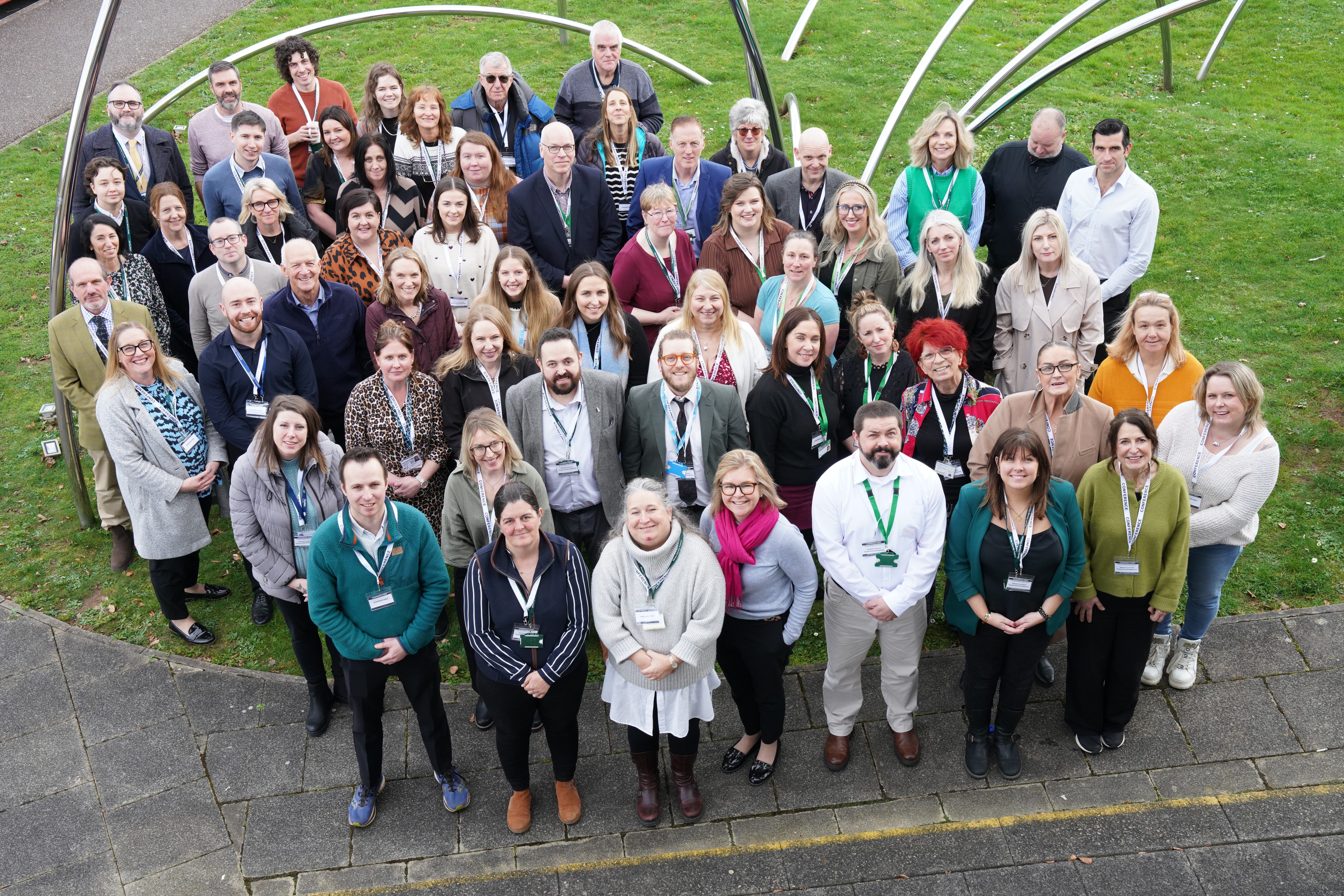 A picture of everyone who attended the Connect to Work collaboration event. The picture is taken from above, looking down on a group people who are looking up at the camera. 