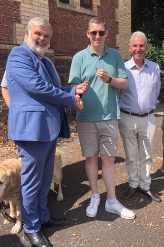 Councillor David Thomas, Leader of Torbay Council, hands keys to Lee Thomas of Paignton Monastery CIC.