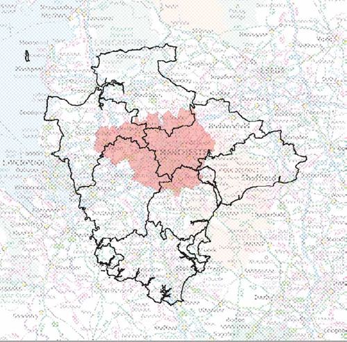 Map of Devon superimposed on a map of Greater Manchester showing Devon's larger size.